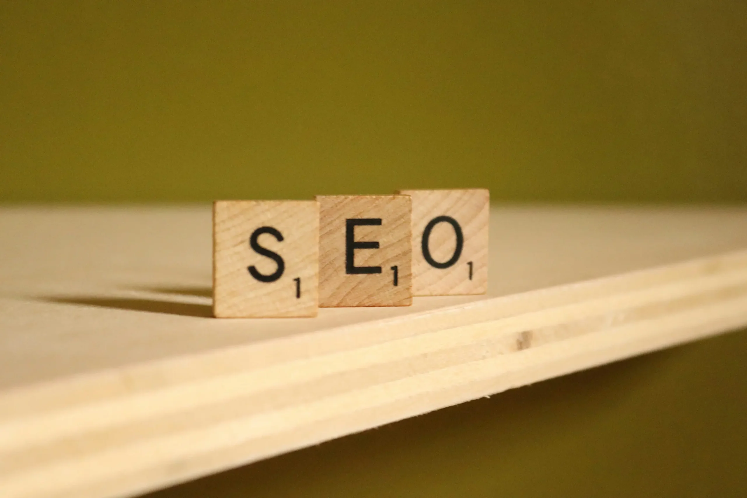 Wooden blocks spelling SEO on desk